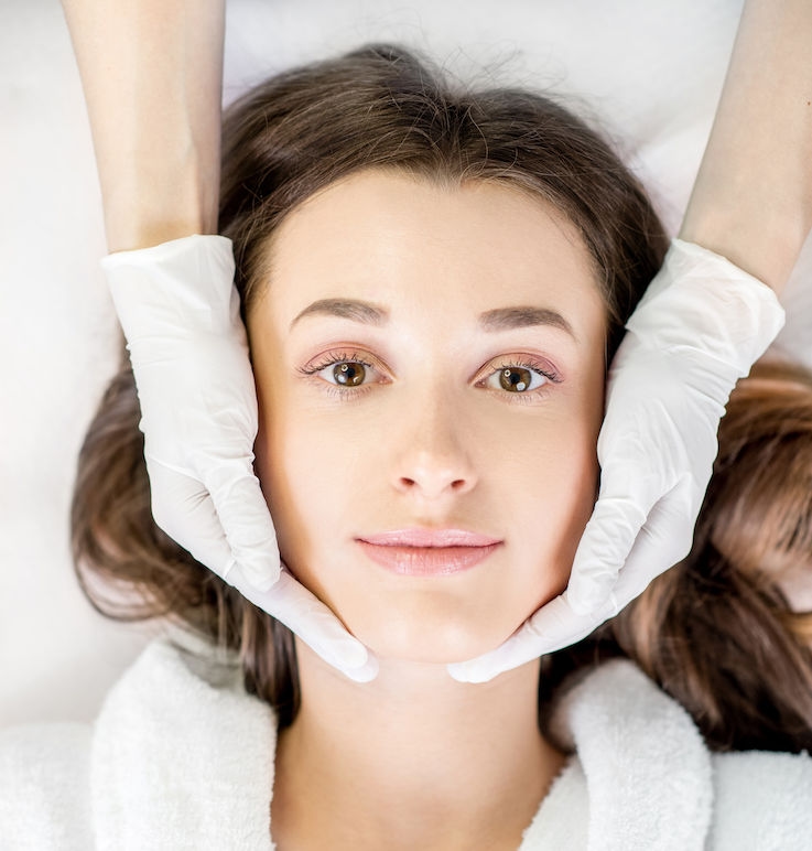 Woman about to get anti wrinkle injections, massage face